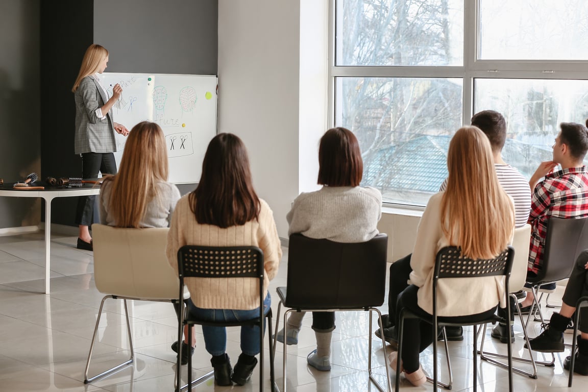 Professional Hairdresser Teaching Young People